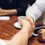 Close up of businessmen shaking hands